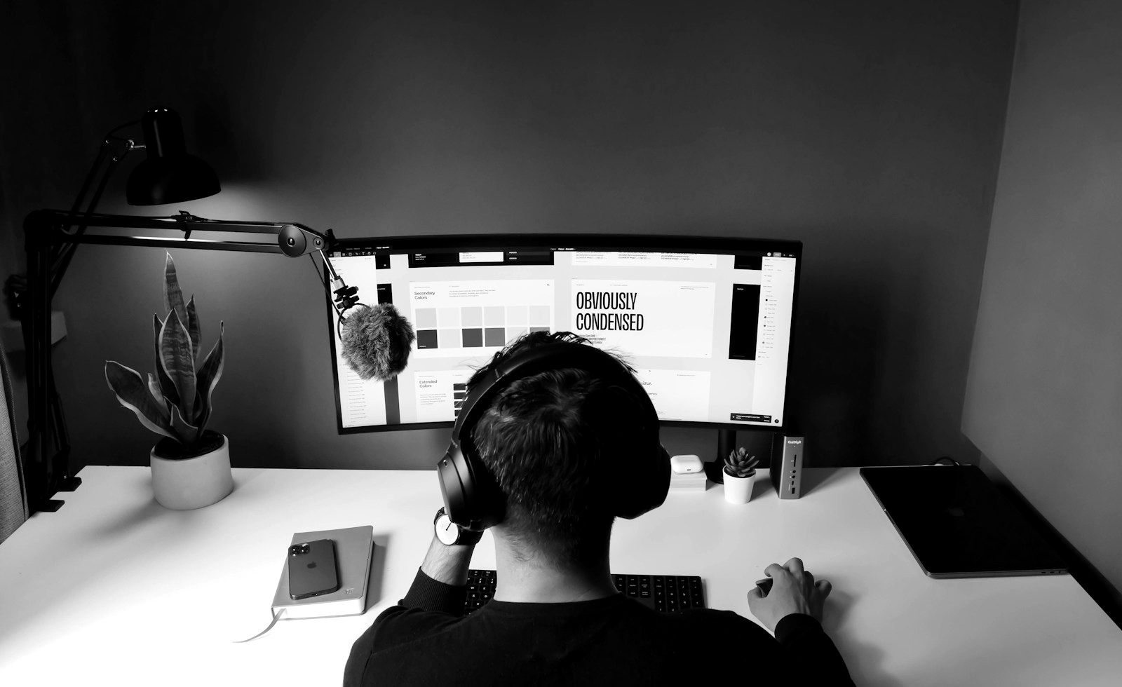 A designer at work on a brand system in the studio